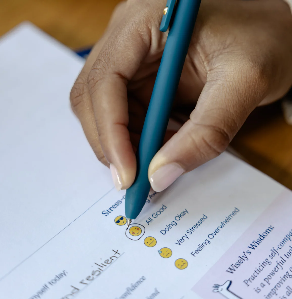 Close-up of a student writing in a Wisely planner