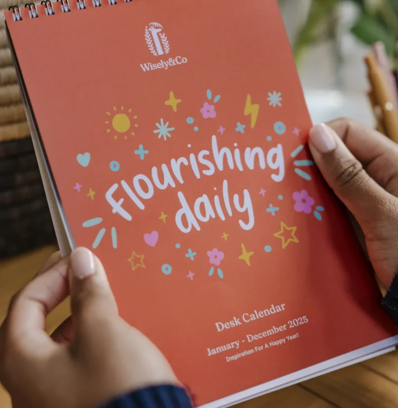 Flourishing daily desk calendar featuring its cover